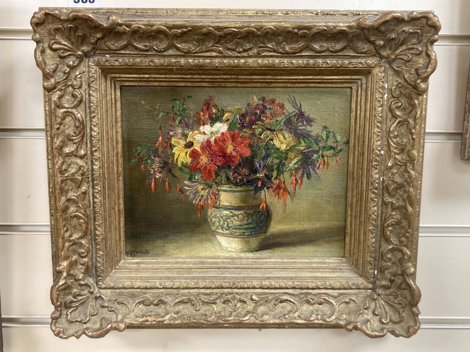 Catherine M. Wood (Exh.1880-1939), oil on canvas board, Still life of flowers in a Poole pottery vase, signed, 17 x 22cm